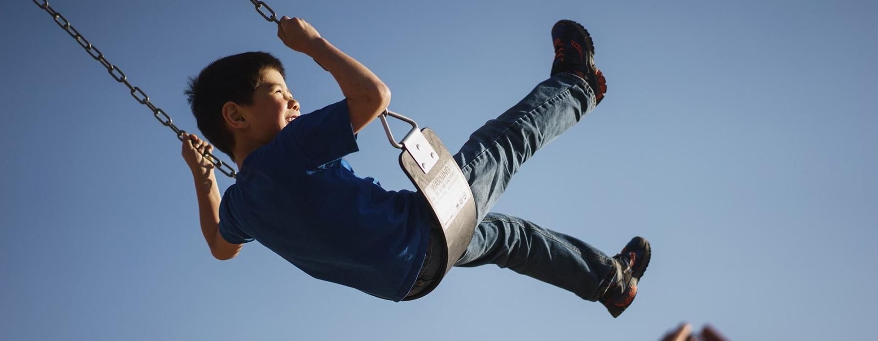 a boy on a swing